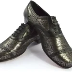 Men’s tango shoe made of black and silver patterned leather.